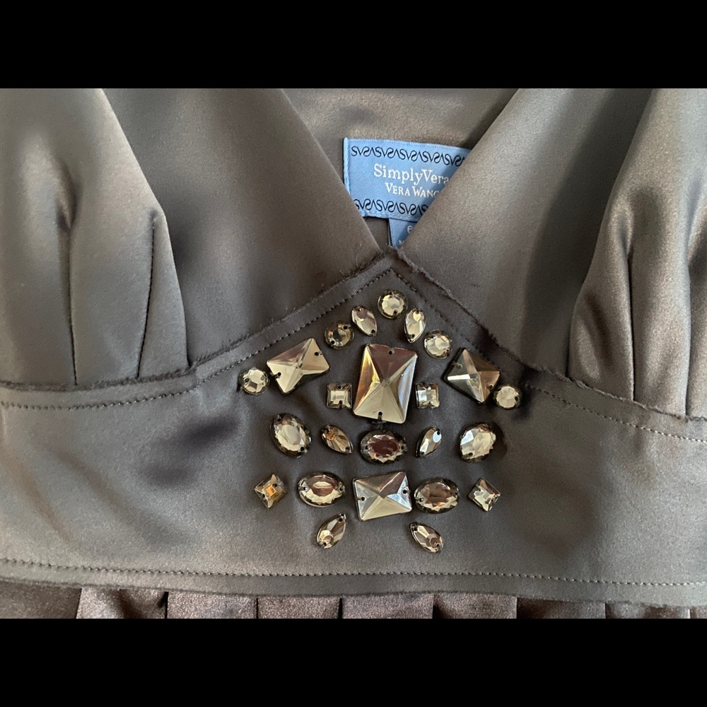 A beautiful slinky cocktail dress with velvet straps and dazzling jewels.